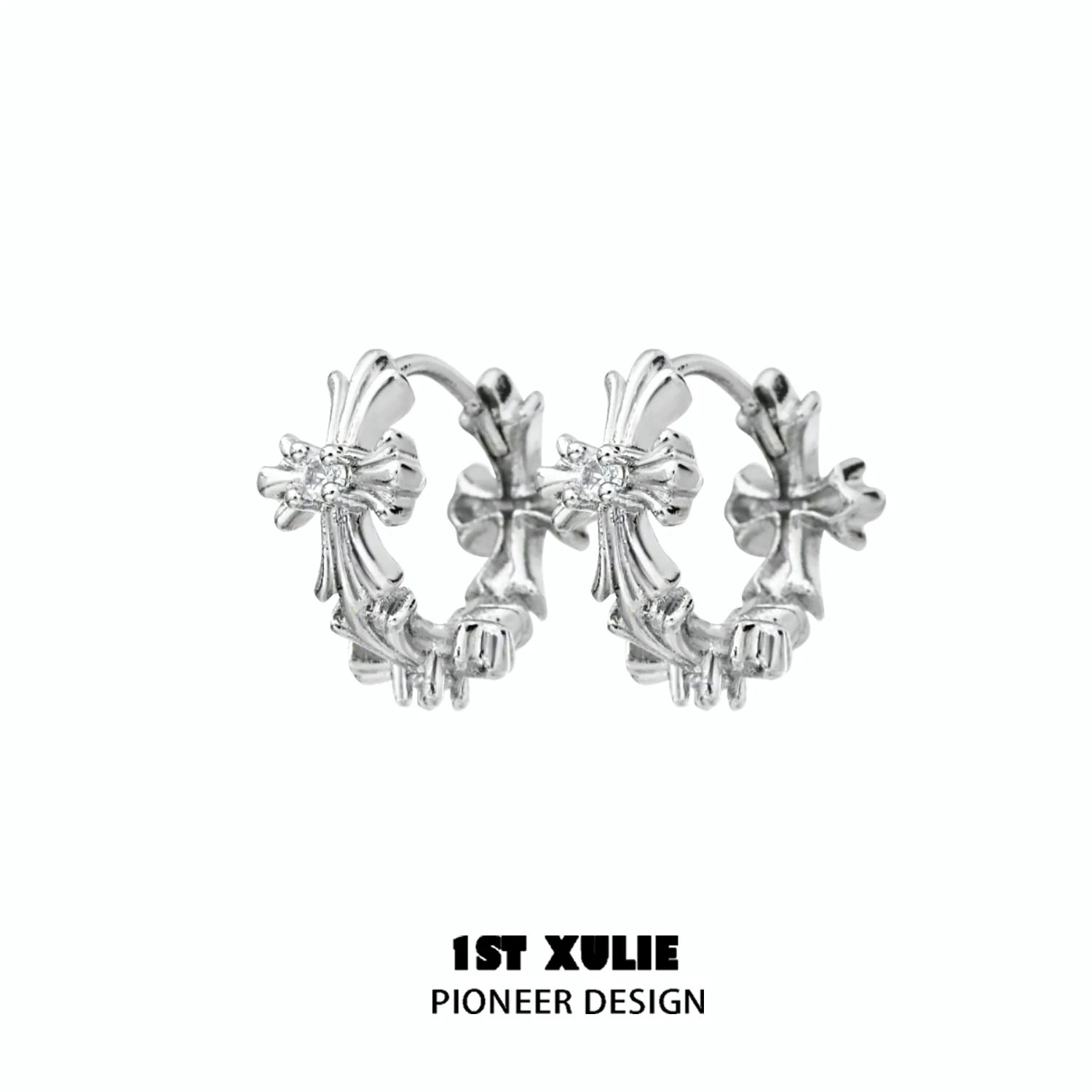 Elegant spiked cross earrings in silver with intricate design, perfect for a bold fashion statement