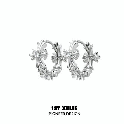 Elegant spiked cross earrings in silver with intricate design, perfect for a bold fashion statement