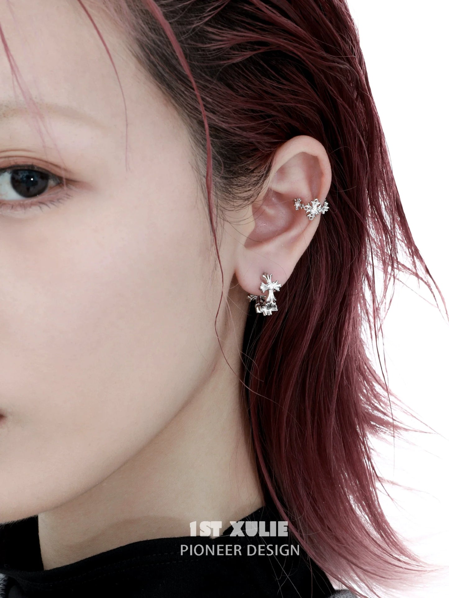Stylish spiked cross earrings in silver design featuring intricate detailing for a modern look