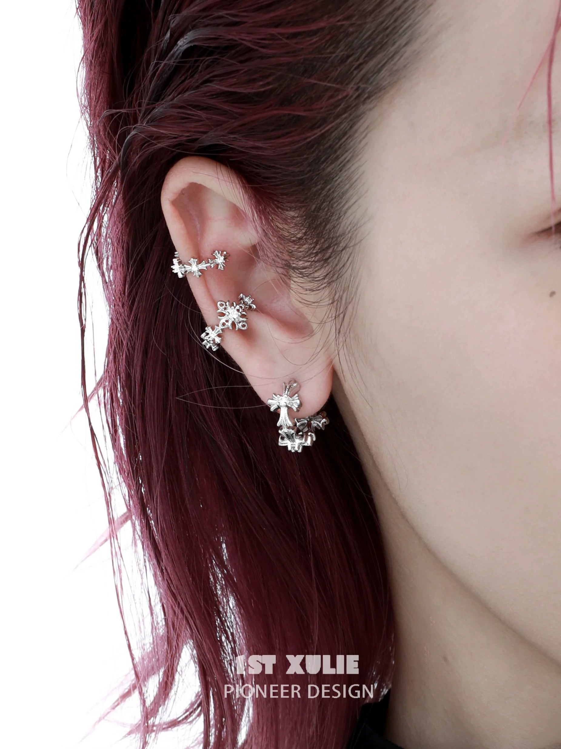 Stylish spiked cross earrings in silver, perfect for adding an edgy touch to any outfit
