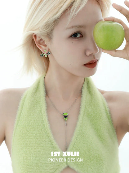 Sweet apple pet removable earrings in a model's ears, paired with a green apple for a fresh look