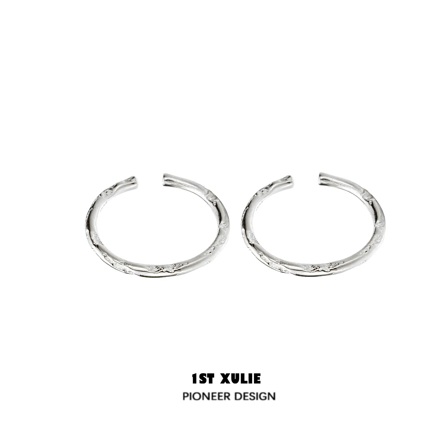 Textured silver ring from 1STXULIE showcases a unique design with intricate detailing
