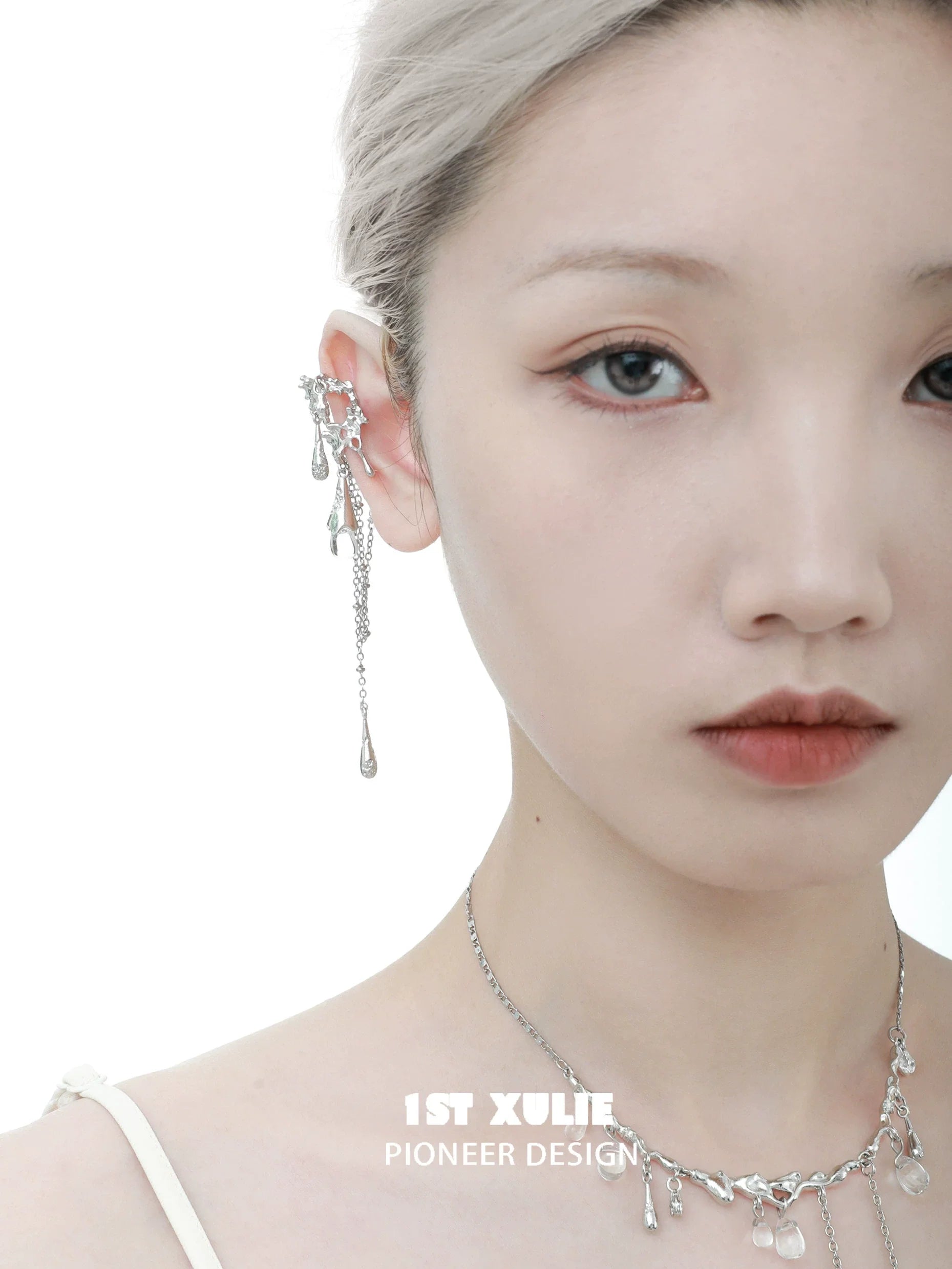 Tidal wave ear cuffs in silver featuring delicate chains and drop accents for a stylish look