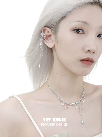Model wearing 1ST XULIE tidal wave ear cuffs with elegant silver detailing and sparkling charms