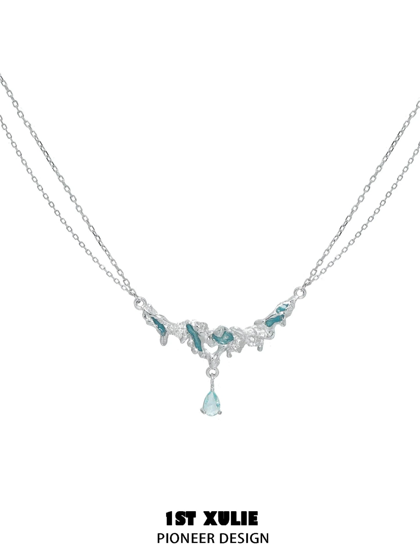 Elegant unique silver sea necklace with blue gemstones and a delicate drop pendant