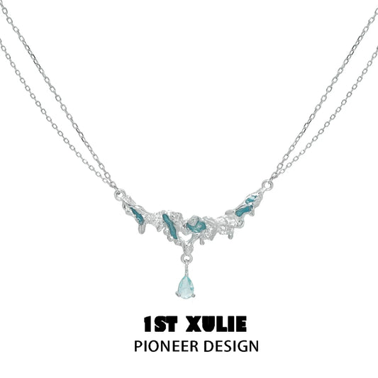 Unique silver sea necklace with intricate design and blue accents for a stylish look