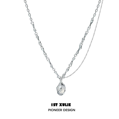 1ST XULIE unique summer pendant necklace in silver with a delicate, artistic design