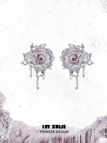 Velvet rose stud earrings with intricate silver detailing and sparkling accents