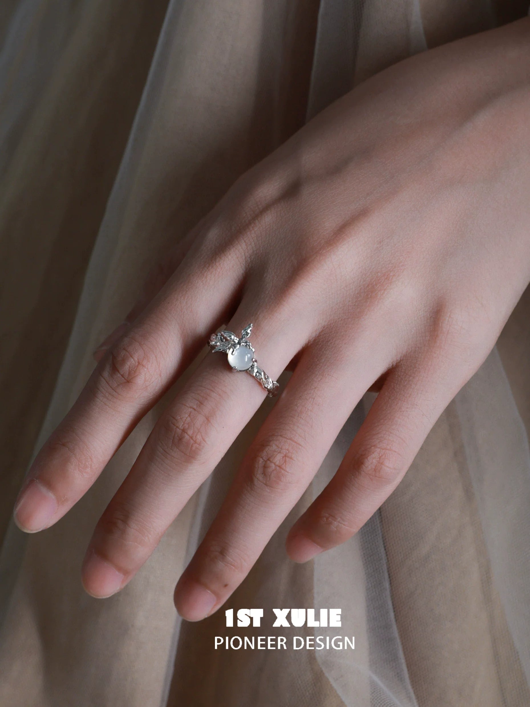 Elegant white agate butterfly silver ring displayed on a model's hand showcasing intricate design