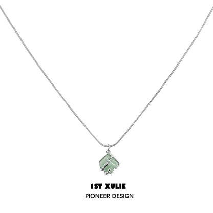 Y2K bamboo necklace from 1ST XULIE featuring a unique leaf pendant on a sleek silver chain