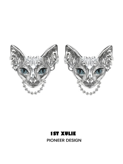 Y2K cat chain earrings in silver with intricate cat face design and blue eyes