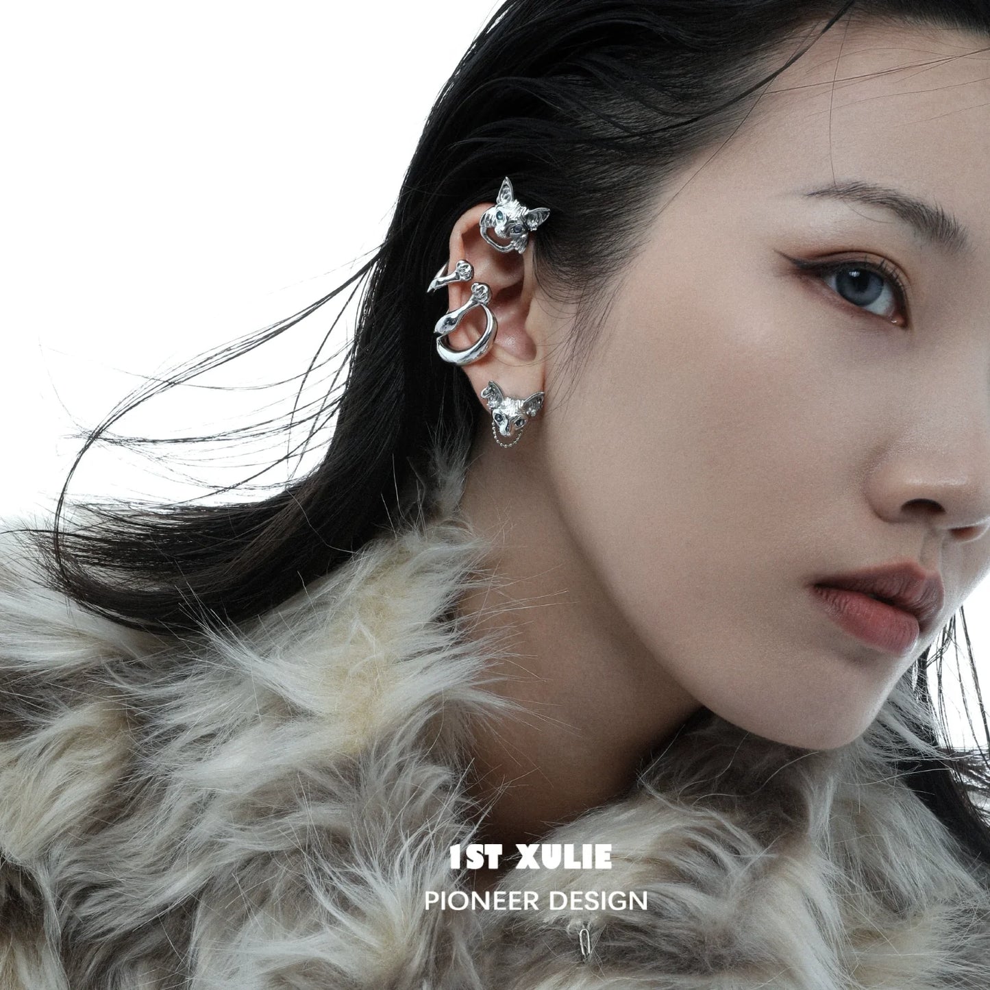Y2K cat ear cuff in silver design worn by a model with trendy hairstyle and fur coat