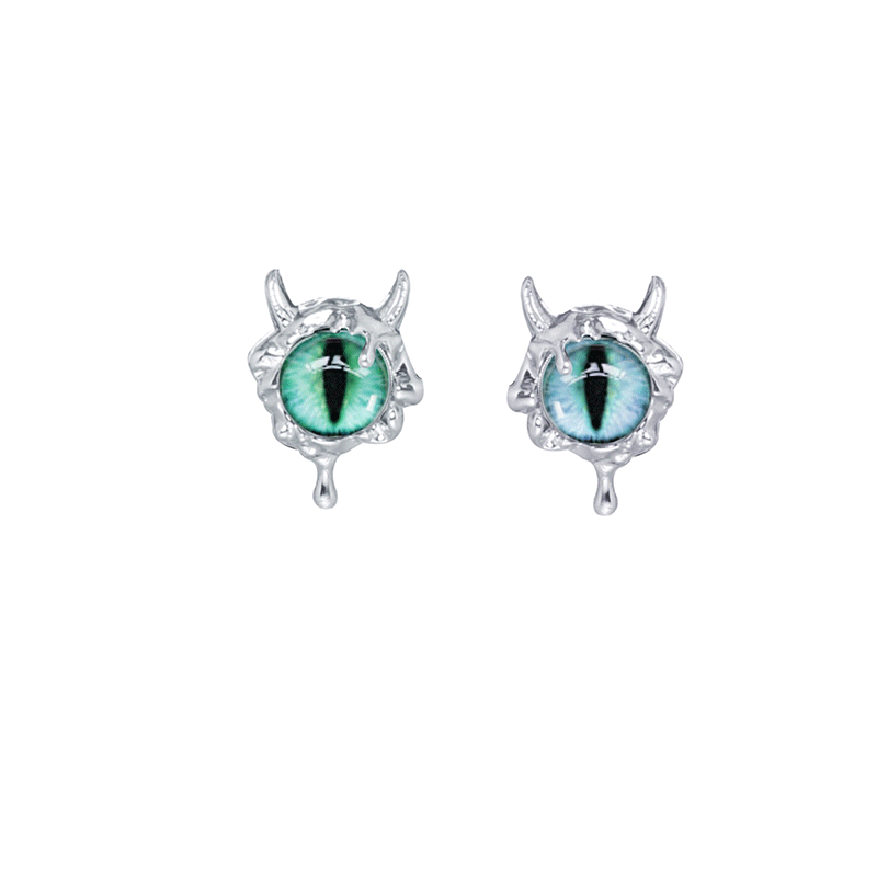 Silver Y2K demon eye earrings featuring a green and blue eye design with detailed horn accents