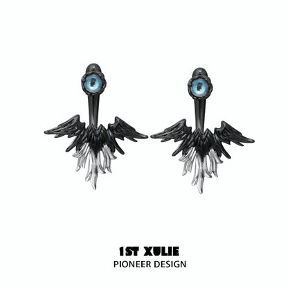 Y2K devil wing earrings featuring a striking black and white design with an eye detail