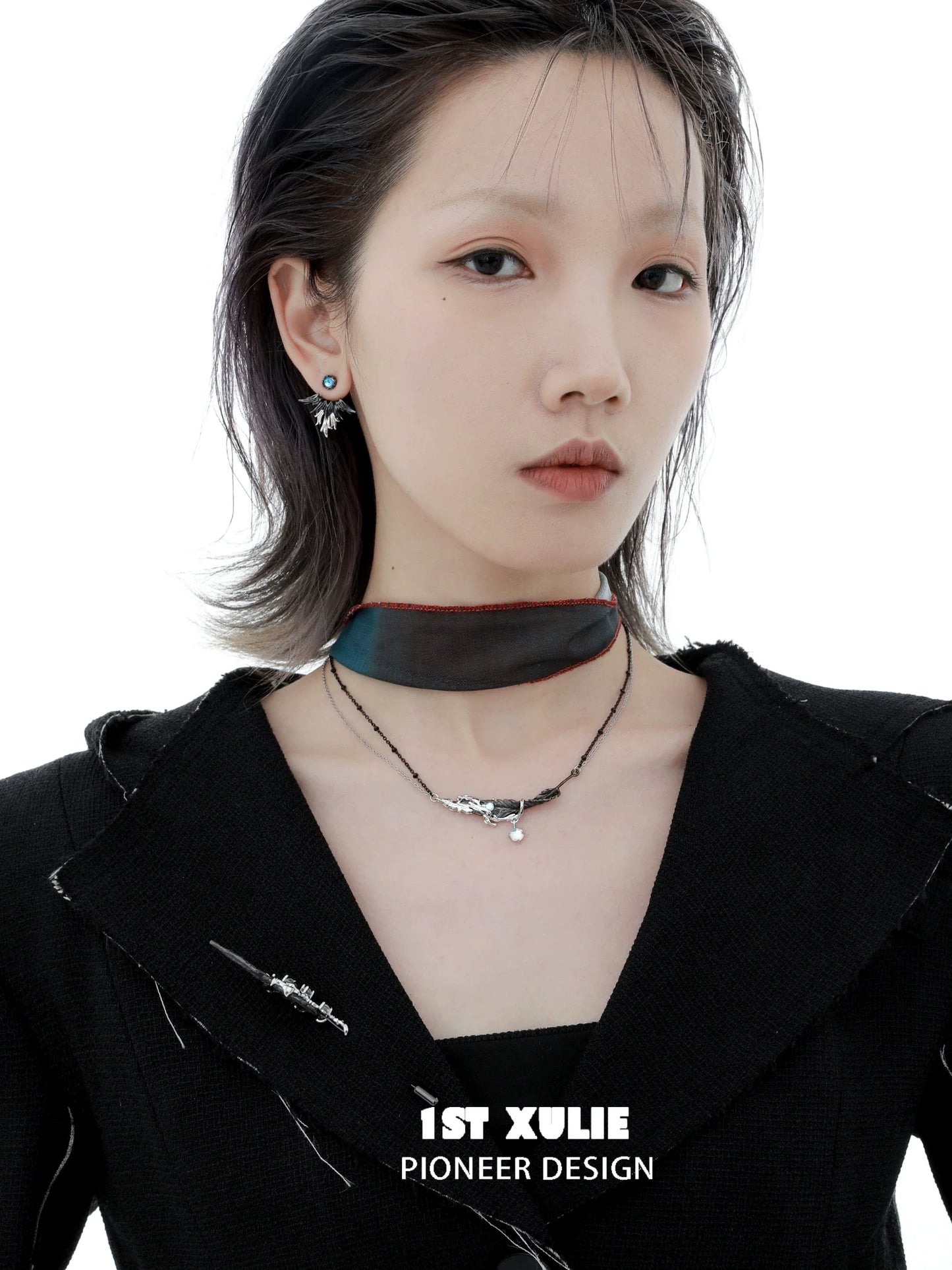 Y2K devil wing earrings showcased on a model with an edgy black outfit and choker