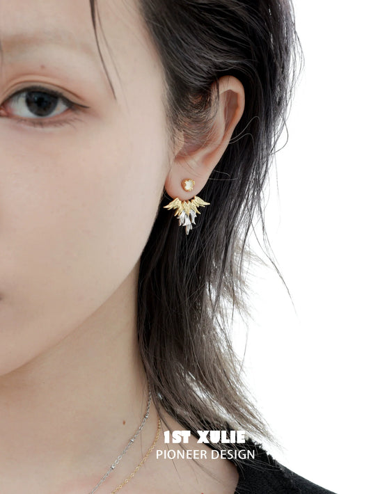Gold Y2K devil wing earrings with sparkling accents, perfect for trendy and stylish outfits