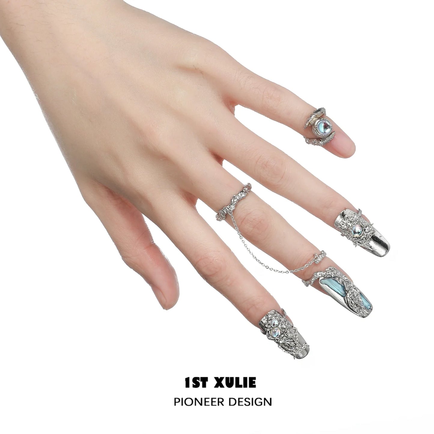 Silver Y2K fairy nail chain ring set worn on elegantly manicured fingers, perfect for trendy accessories