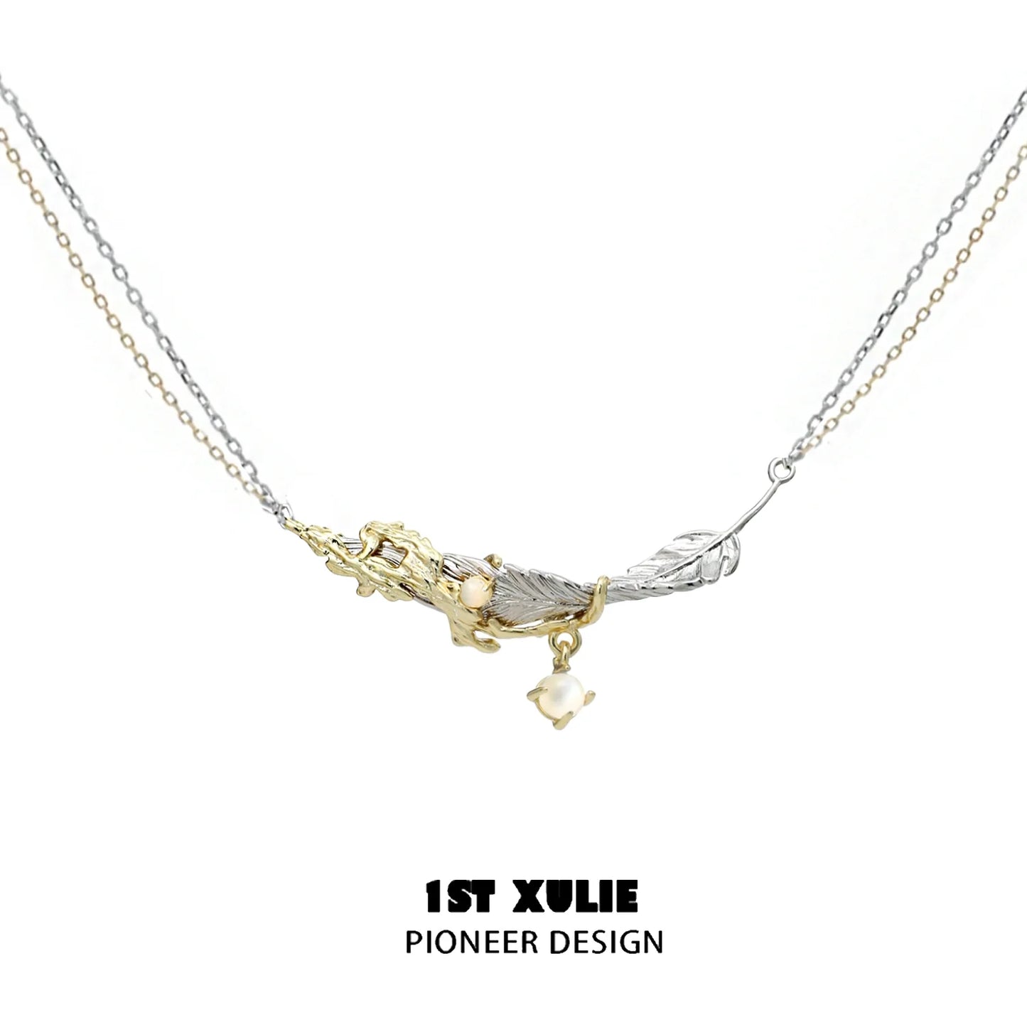Stylish Y2K feather necklace with silver and gold chains, featuring a unique design and charm.