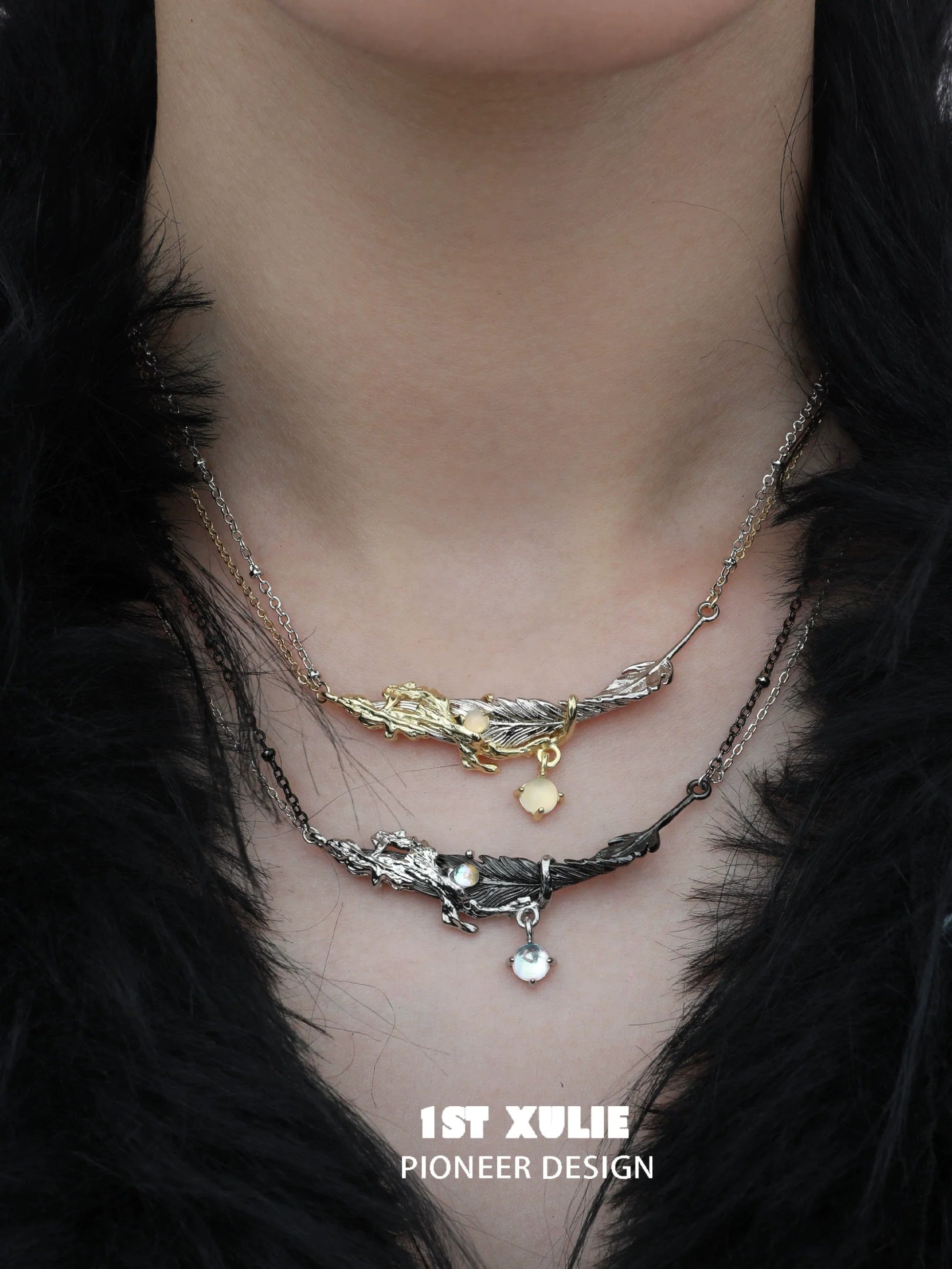 Y2K feather necklace by 1ST XULIE featuring layered silver and gold designs with decorative charms