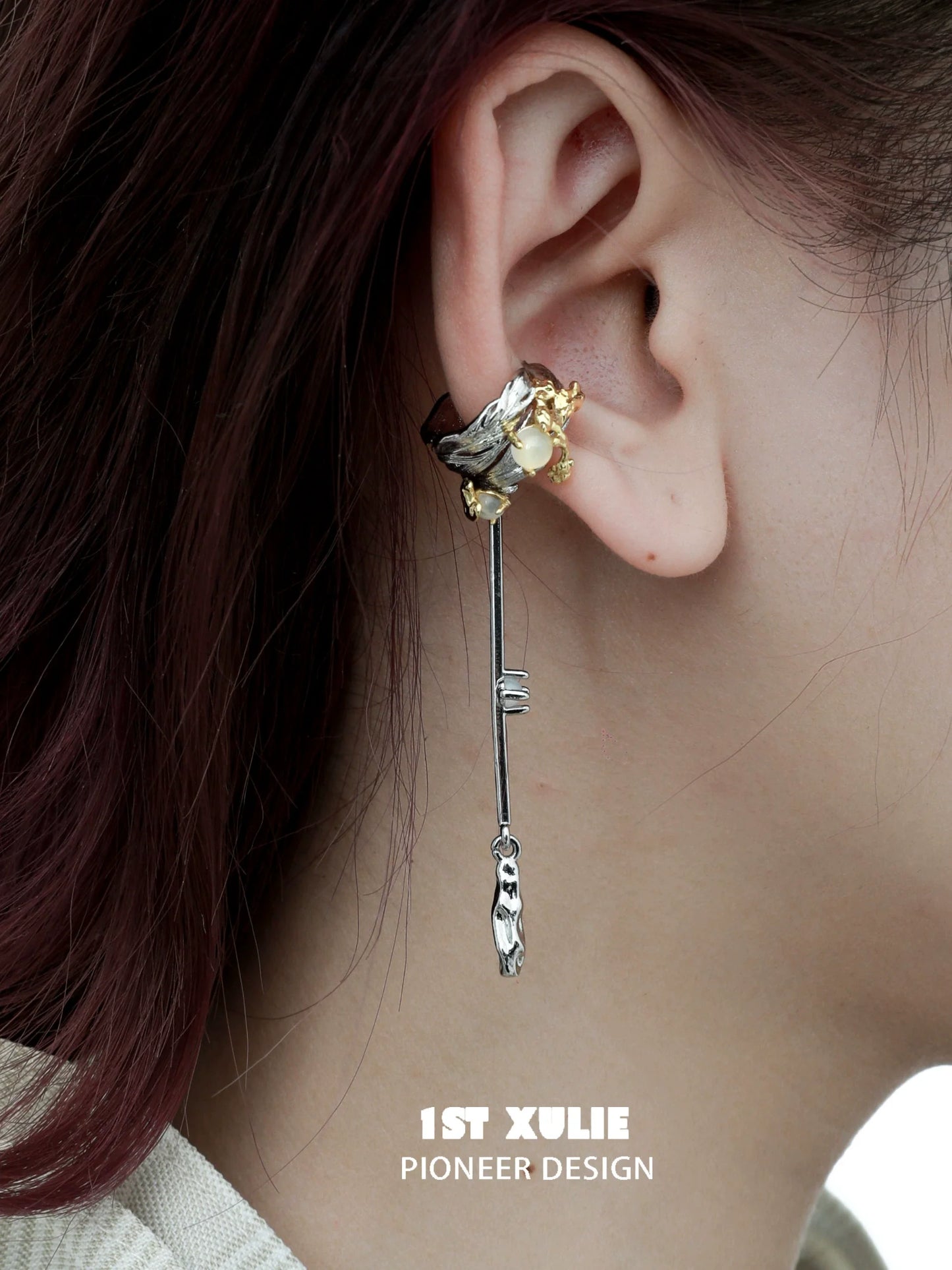 Y2K feather tassel ear clip featuring a unique design with silver and gold embellishments
