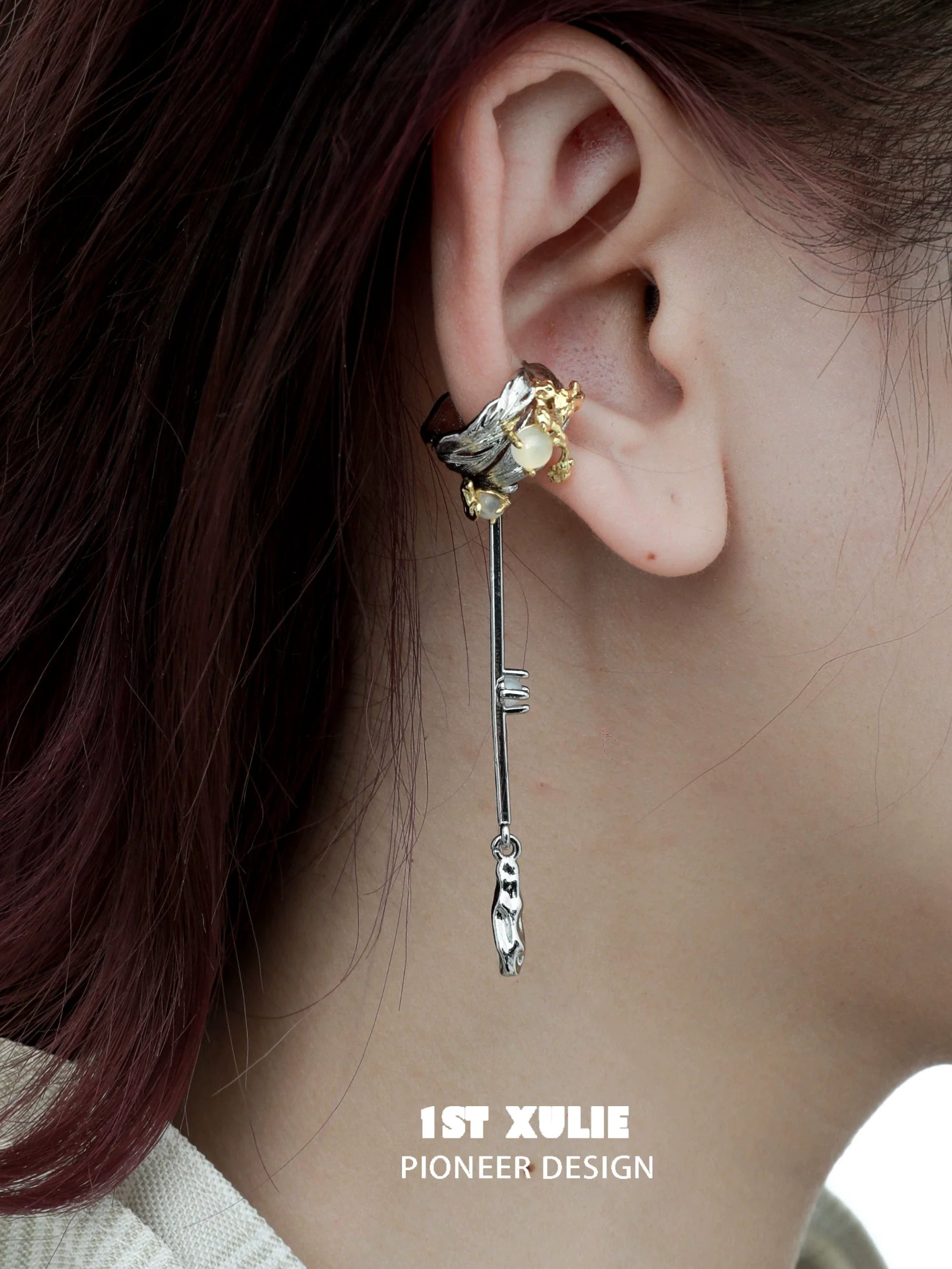 Y2K feather tassel ear clip featuring a unique design with silver and gold embellishments