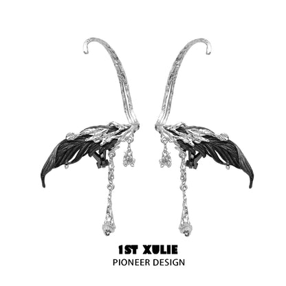Y2K feather tassel earrings in silver with intricate designs and dangling accents