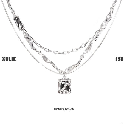 Y2K frost gem necklace featuring layered silver chains and a unique pendant design