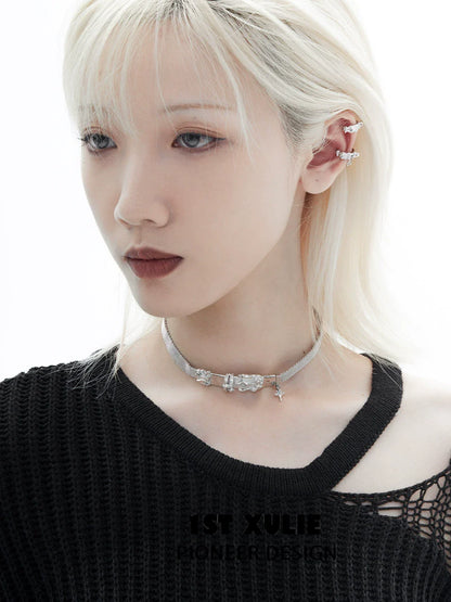 Y2K frozen breeze ear clips showcased on a model with platinum blonde hair and a black top