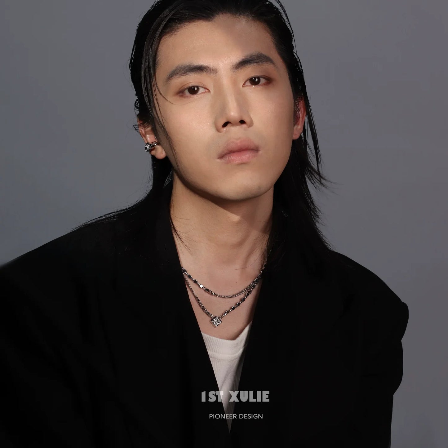 Model wearing a stylish Y2K galaxy necklace layered with silver chains for a trendy look