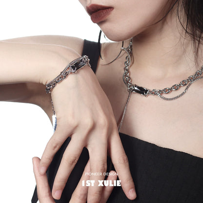 Y2K gray diamond punk bracelet with a unique chain design worn elegantly on a model's wrist