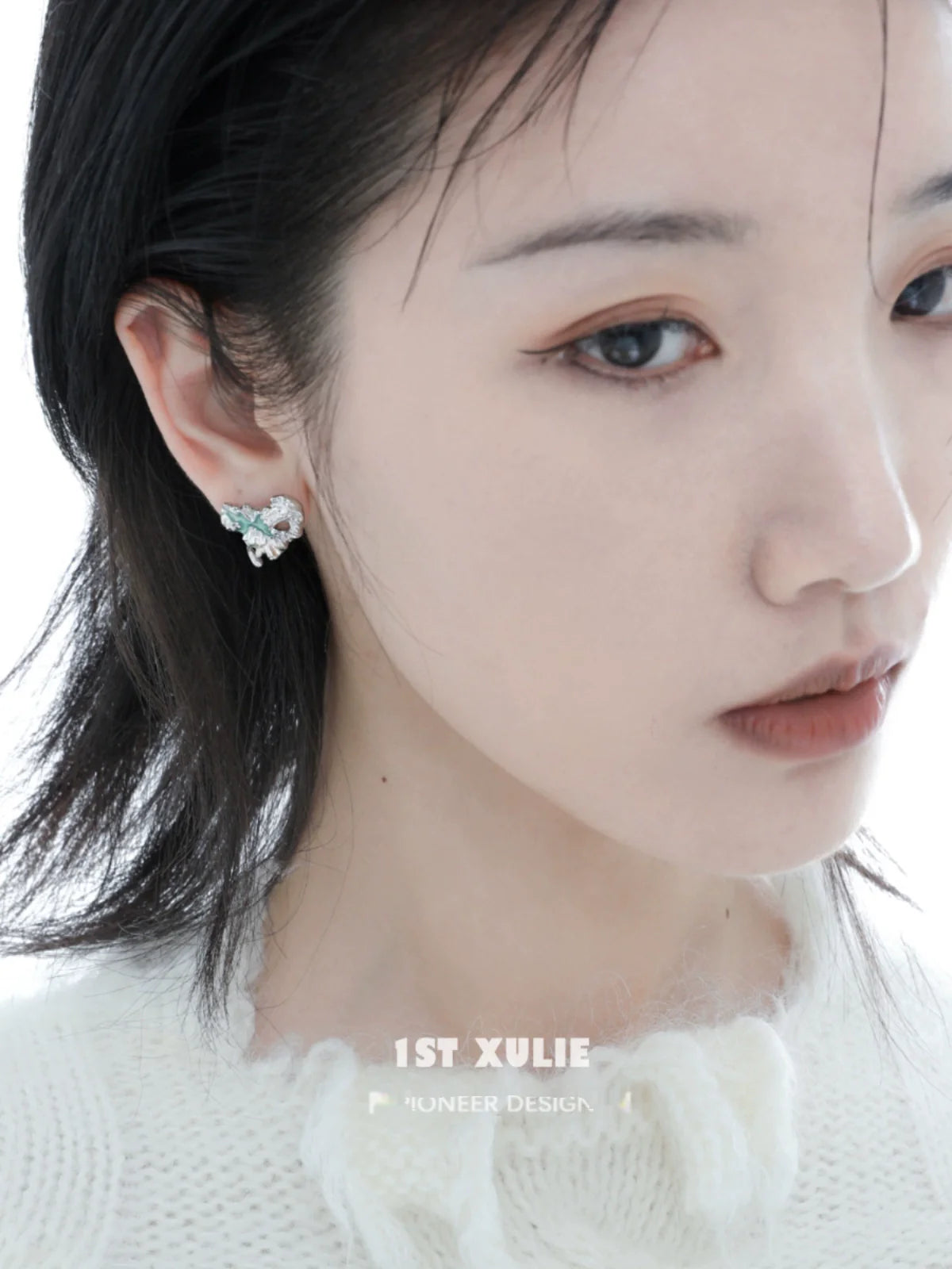 Model wearing 1STXULIE Y2K melting love earrings featuring unique design and sparkling crystals