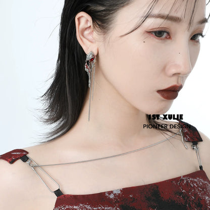 Y2K post-apocalyptic earrings featuring a unique design with chain and metal details, perfect for edgy fashion