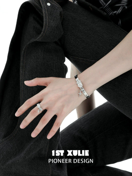 Y2K silver belt bracelet from 1ST XULIE styled on a model's wrist, paired with denim for a trendy look