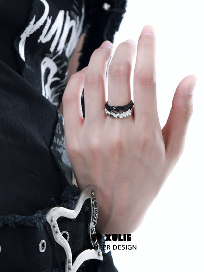 Y2K silver couple ring displayed on hand with black outfit, showcasing its modern design and style