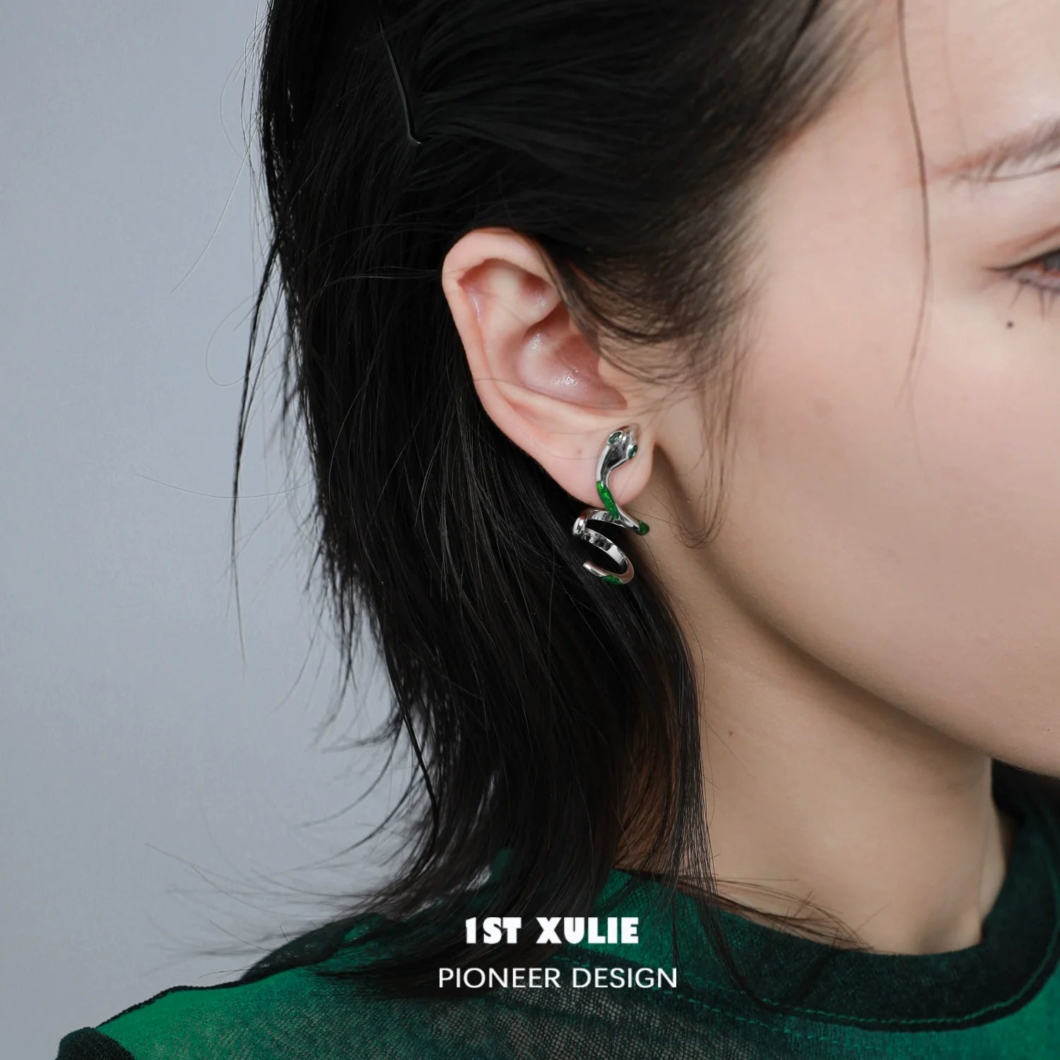 Y2K Slytherin snake earrings styled on a model showcasing vibrant green accents