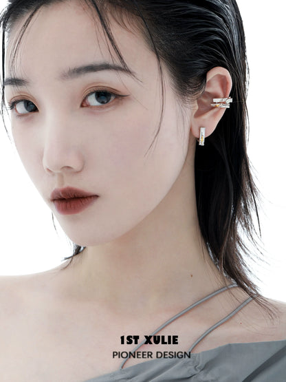 Model wearing a stylish Y2K star ear cuff from 1ST XULIE showcasing modern ear jewelry design