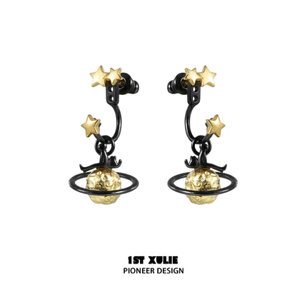 Y2K star earrings featuring gold stars and planet design on black metal hoops