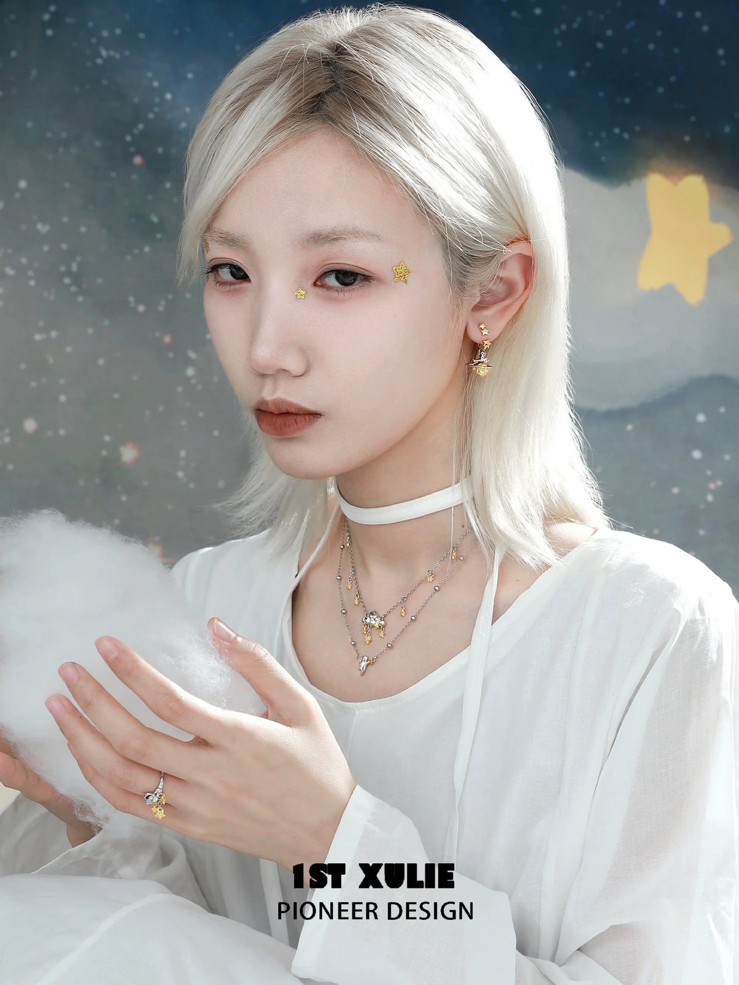 Model wearing Y2K star earrings with a white top in a dreamy celestial background