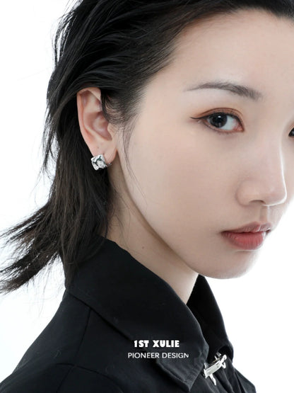 Stylish model wearing Y2K textured earrings with a modern design and sleek finish