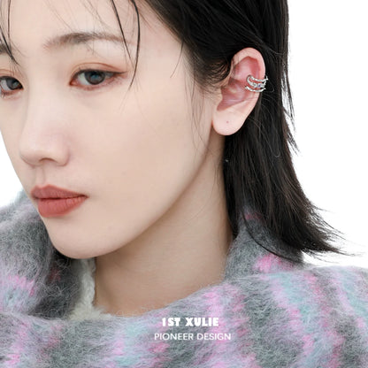 Stylish zircon ear cuffs by 1STXULIE showcased on a model for trendy accessorizing