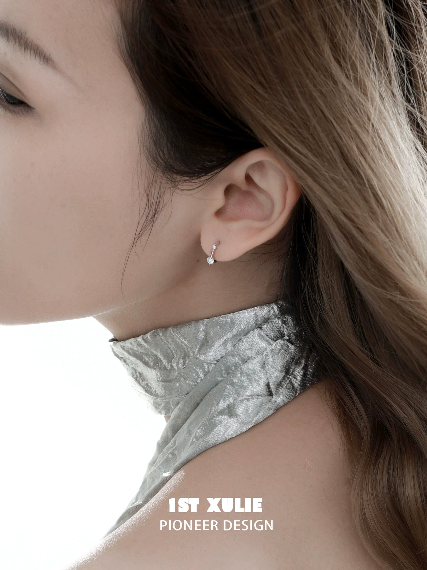 Elegant 1STXULIE zircon stud earrings for women displayed on a model's ear