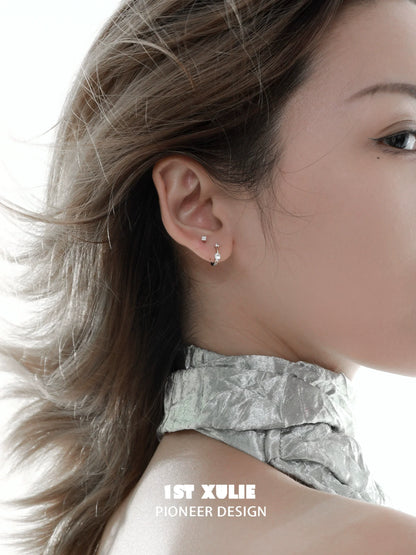 Stylish zircon stud earrings for women showcased in a portrait of a model with flowing hair