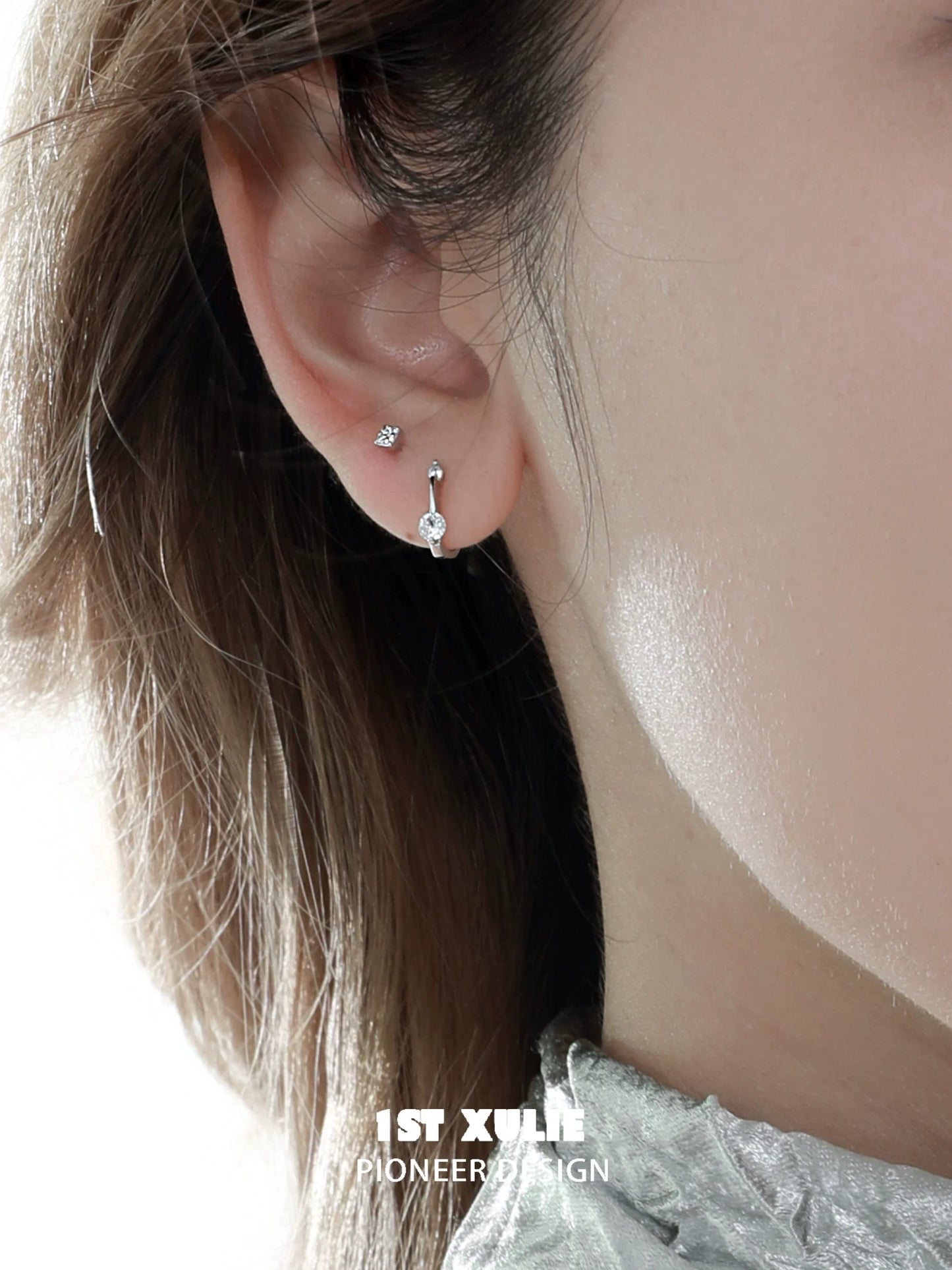 Elegant zircon stud earrings for women showcased on a model's ear for a stylish look