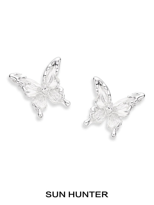Elegant SUN HUNTER 3D butterfly earrings in silver for a stylish and whimsical look