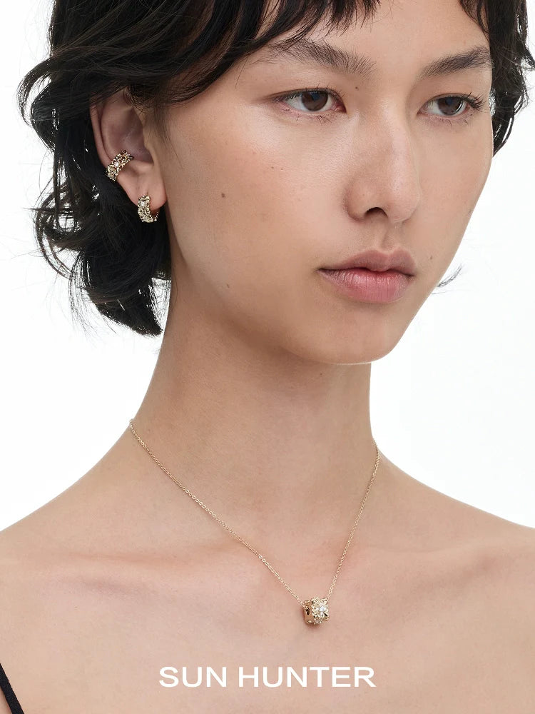 Model wearing vintage iris ear cuff with delicate gold chain necklace from SUN HUNTER