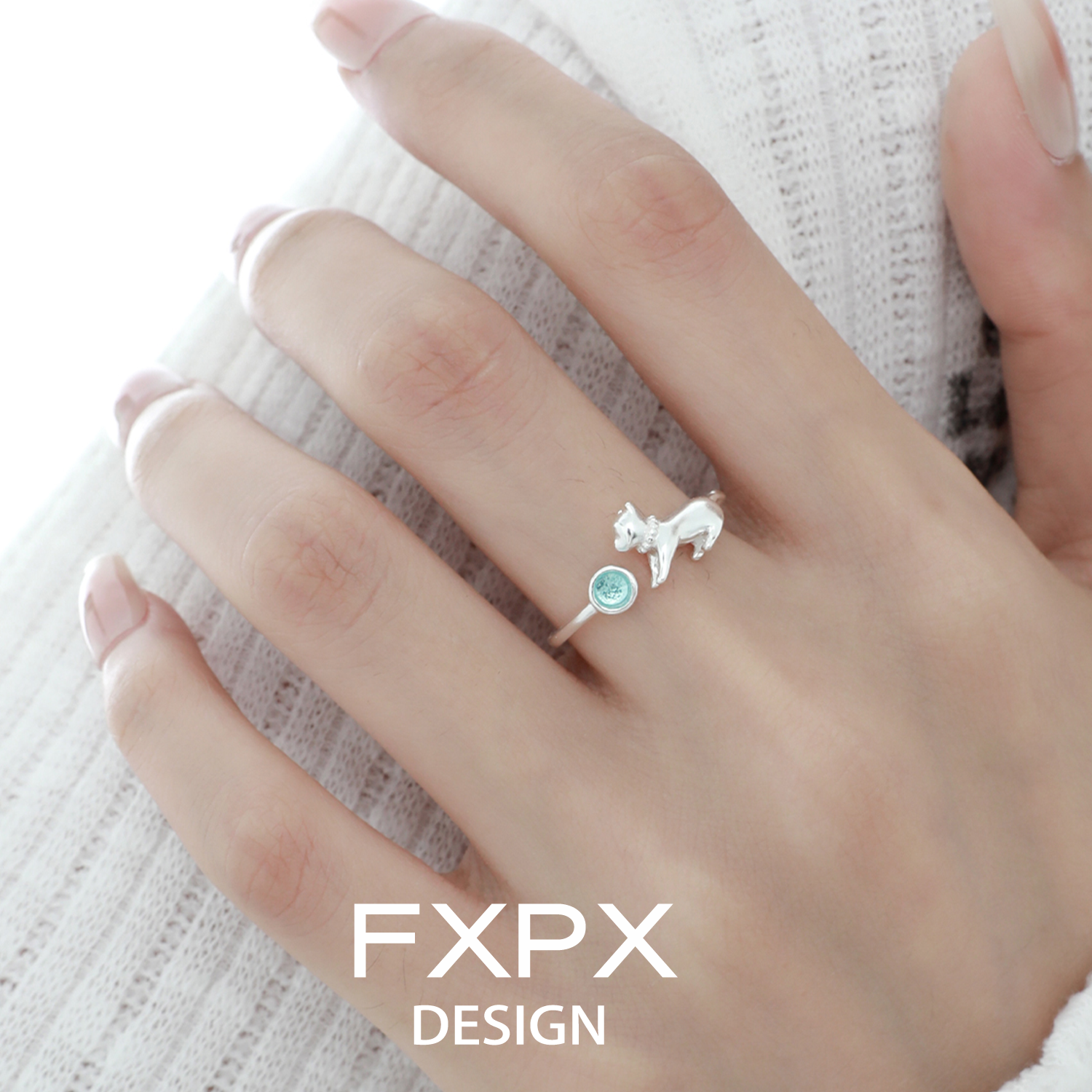 Cute blue cat ring by FXPX featuring a silver cat design and a blue gemstone accent