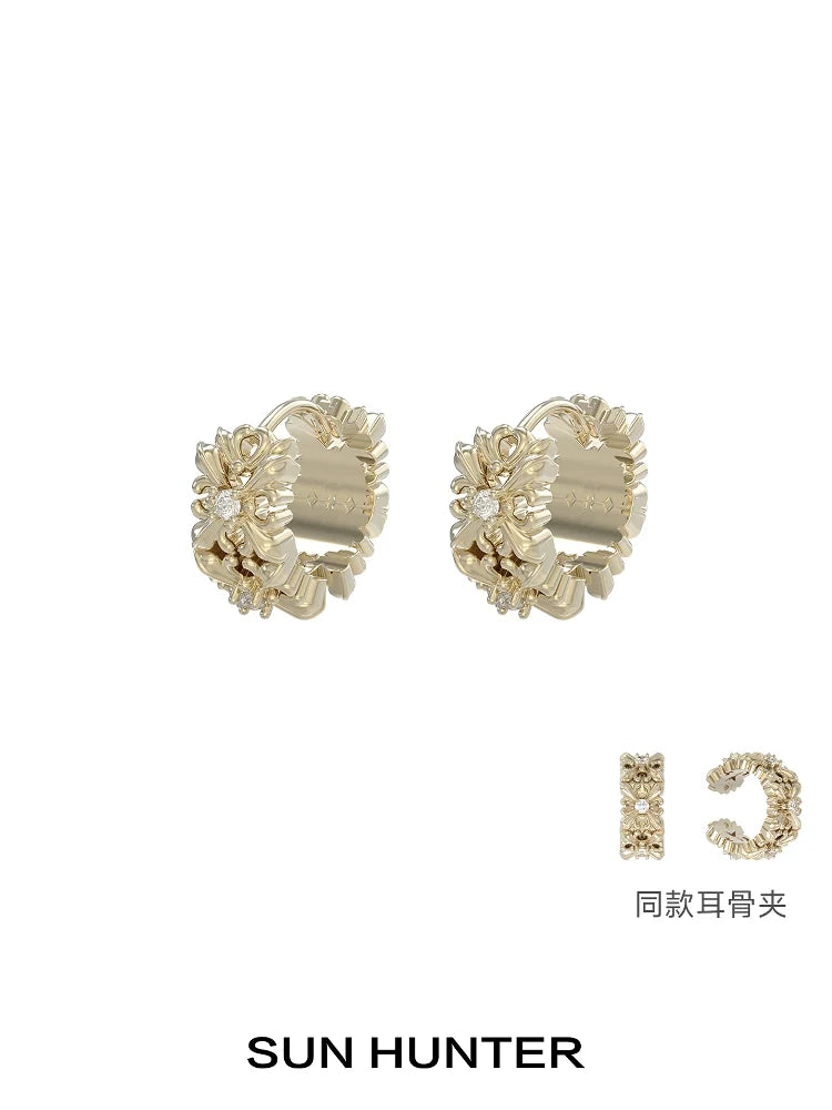 Elegant SUN HUNTER vintage iris ear cuff with floral design and sparkling accents