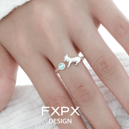 Cute blue cat ring in silver with a playful cat design and a blue gemstone accent