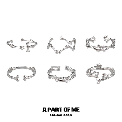 Set of six abstract bone silver rings from A PART OF ME featuring unique skeletal designs