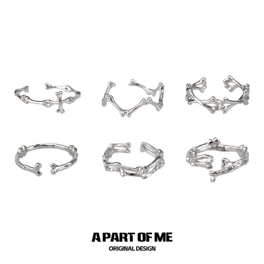 Set of six abstract bone silver rings from A PART OF ME featuring unique skeletal designs
